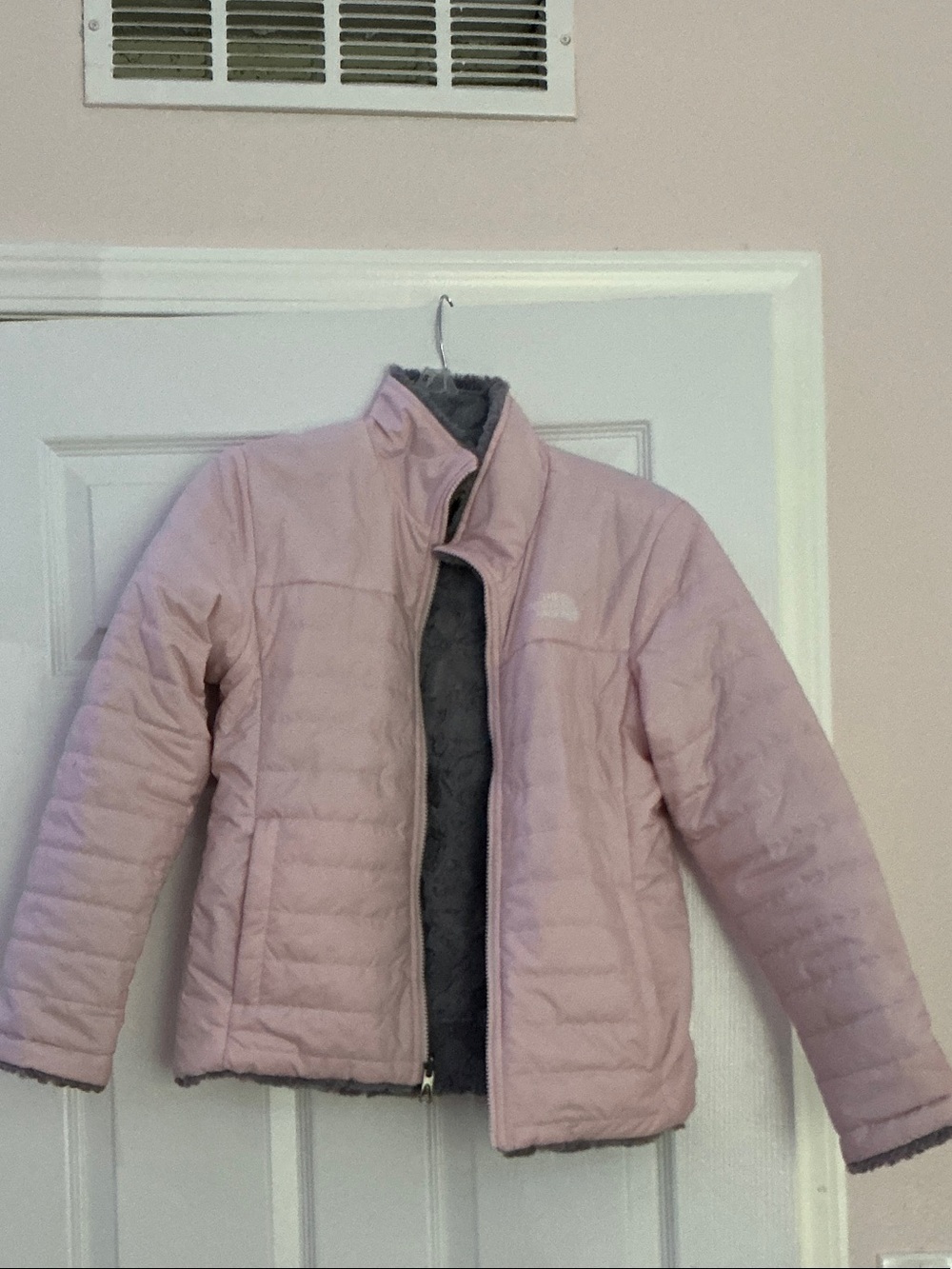 The North Face Kids Light Pink Puffer Jacket with Gray Fleece Interior